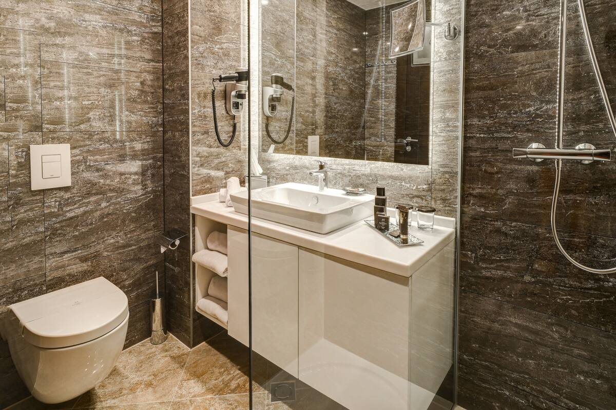 shower, hair dryer, bathrobes, slippers