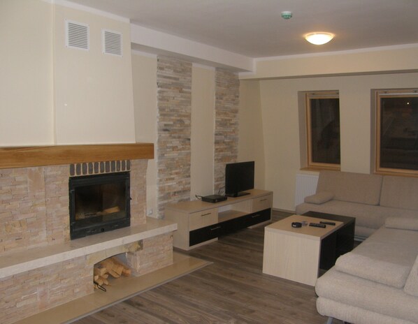 Apartment, 1 Bedroom | Living area | Flat-screen TV