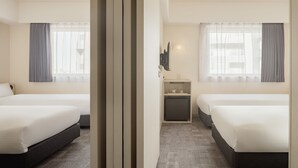 A hotel room with two beds, a small desk, a mirror, and a window with curtains. - Nesthotel alt. Meguro Station (Tokyo)