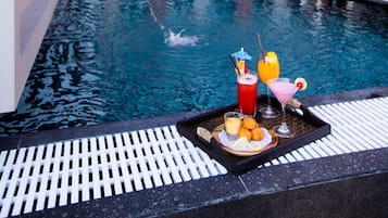 Outdoor pool, open 7:00 AM to 6:00 PM, pool umbrellas, pool loungers