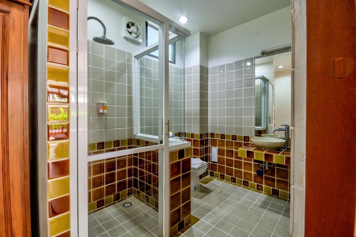 family room | bathroom | shower, rainfall showerhead, free toiletries, hair dryer