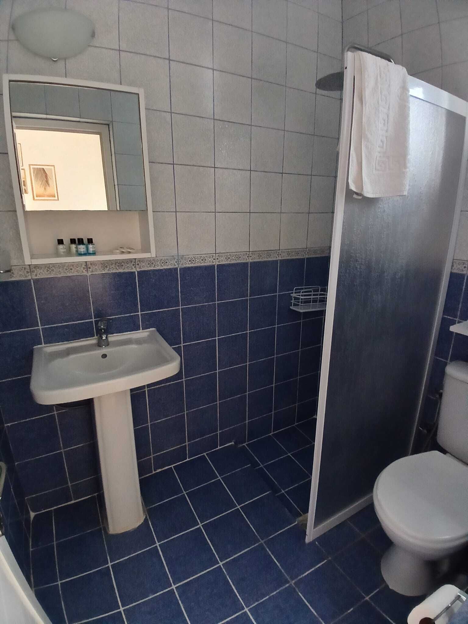 rainfall showerhead, free toiletries, hair dryer, slippers