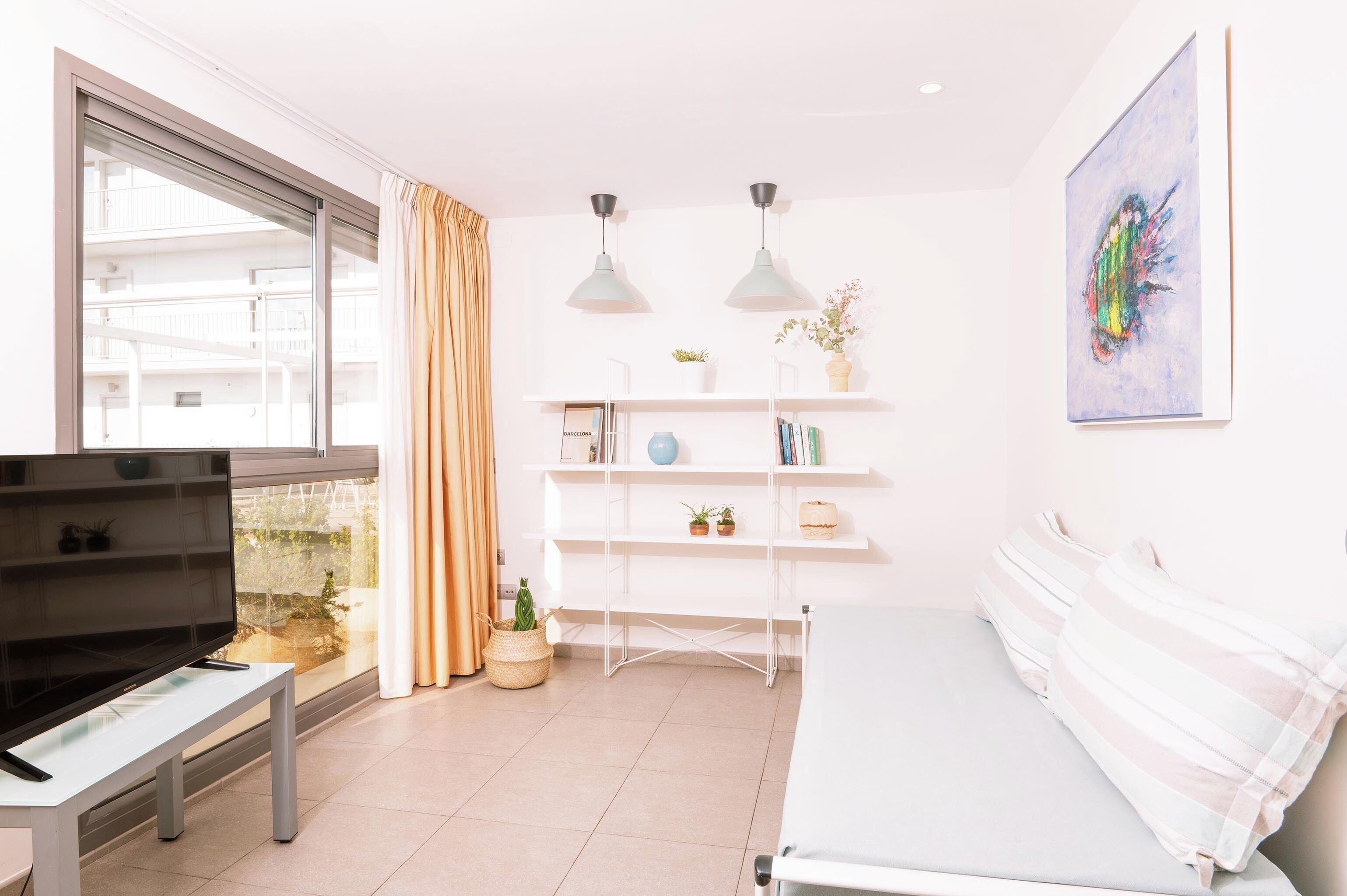 Apartamento Familiar, 2 Dormitorios, sin terraza (6 adultos) | Woonruimte | Een 22-inch flatscreentelevisie met satellietzenders en een televisie