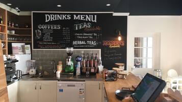 A café with a drinks menu, coffee and tea options, and a section for herbal teas.