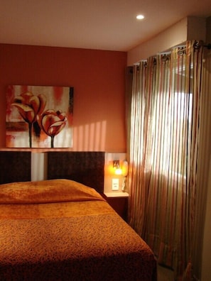 Blackout drapes, soundproofing, iron/ironing board, free WiFi