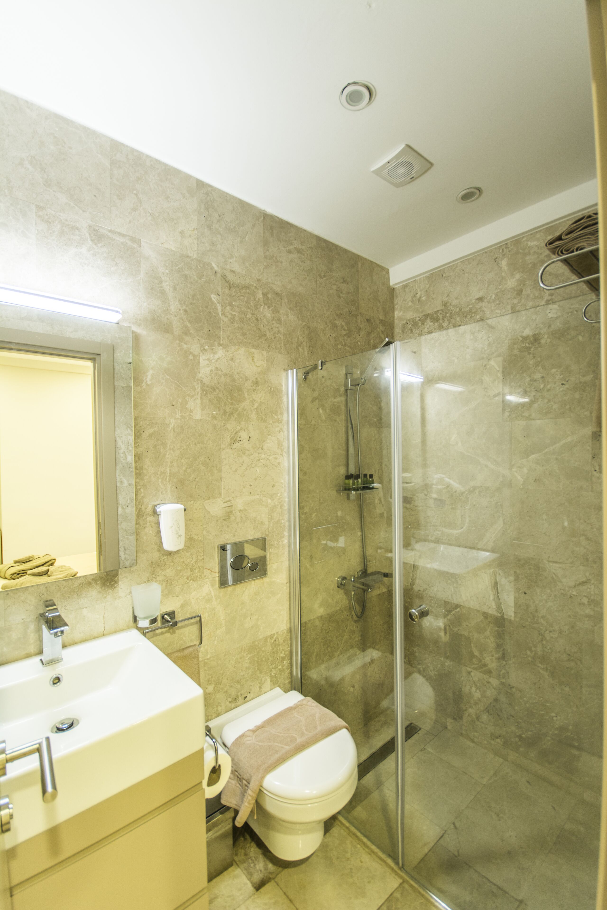 economy room | bathroom | shower, free toiletries, hair dryer, slippers