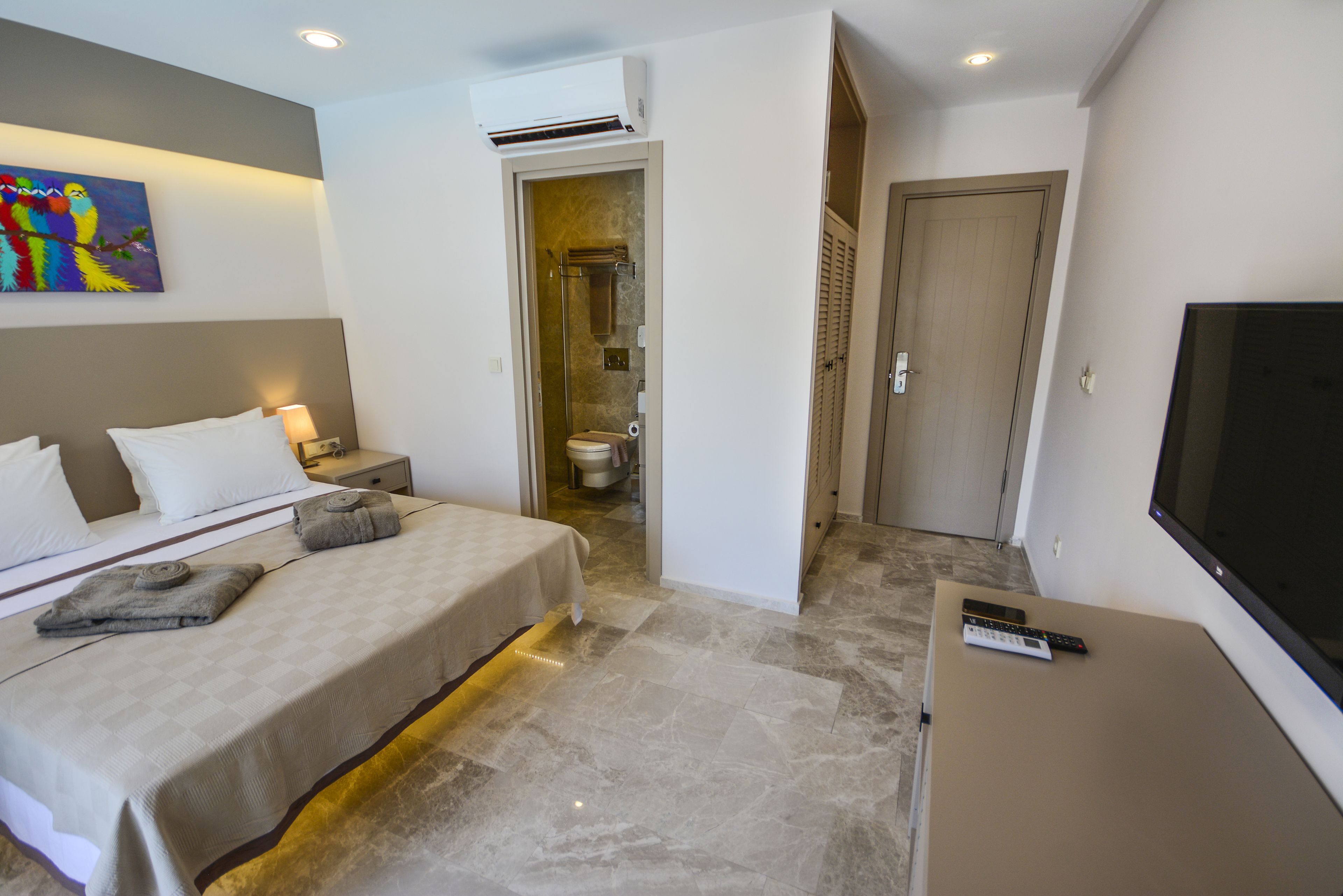 deluxe double room, 1 bedroom, balcony, city view | in-room safe, desk, laptop workspace, iron/ironing board