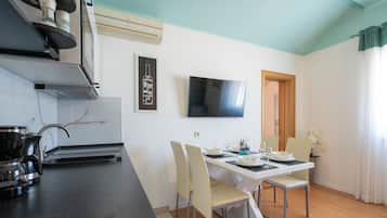 Apartment, Sea View | Living area | Plasma TV