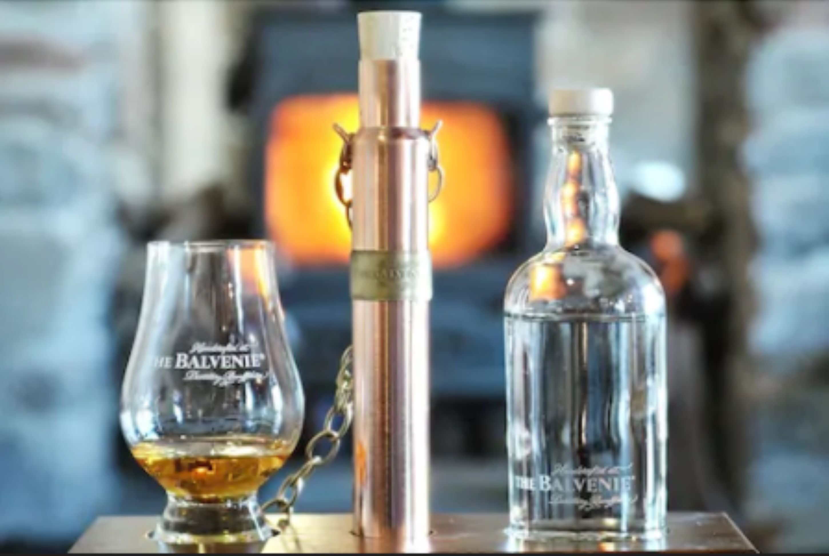 Three bottles of The Balvenie whisky on a table.