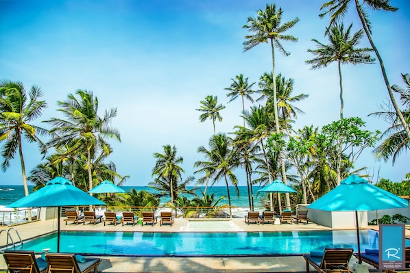 On the beach, sun loungers, beach umbrellas