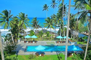 Outdoor pool, pool umbrellas, sun loungers