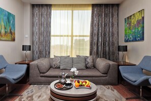 Suite Exécutive, 1 très grand lit | Coin séjour