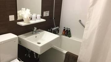 Combined shower/tub, free toiletries, hair dryer, slippers