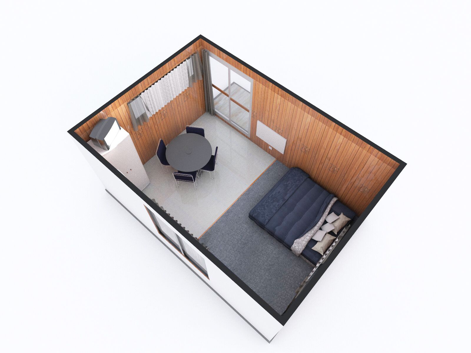 A compact room with a round table and chairs, a bed, and a sliding glass door leading to a balcony.