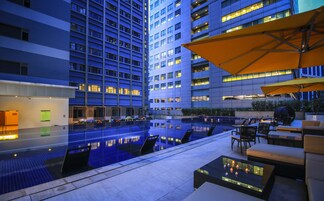 Outdoor pool, open 6:00 AM to 10:00 PM, pool umbrellas, sun loungers