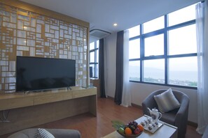 Royal Suite, 1 Bedroom, Ocean View, Oceanfront | Living area | 32-inch flat-screen TV with cable channels, TV - Royal Huy Hotel (Da Nang)