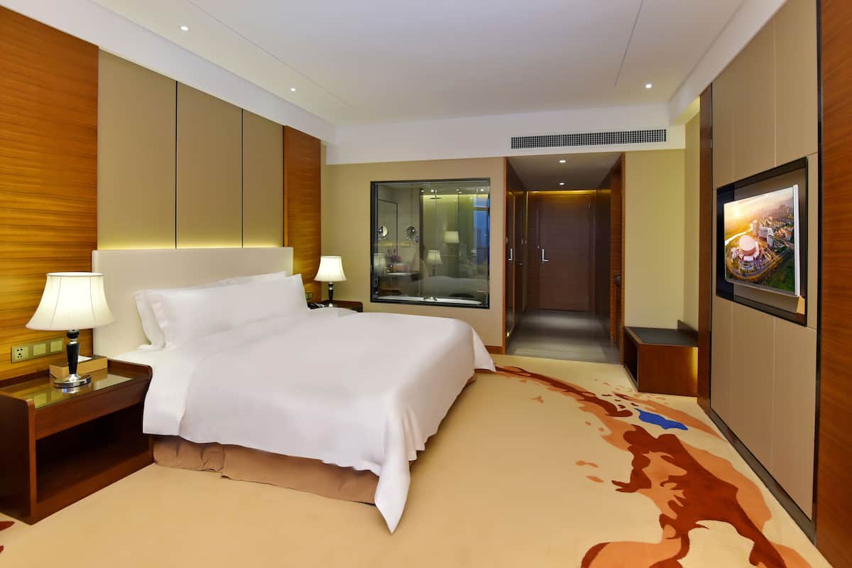 Luxe beddengoed, een minibar, een kluis op de kamer, een bureau