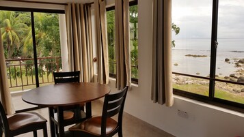 Superior Apartment, Sea View, Beachside | Living area | 30-inch flat-screen TV with satellite channels, TV