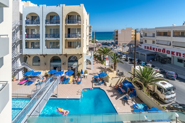 2 outdoor pools, open 10:00 AM to 6:00 PM, pool umbrellas, pool loungers