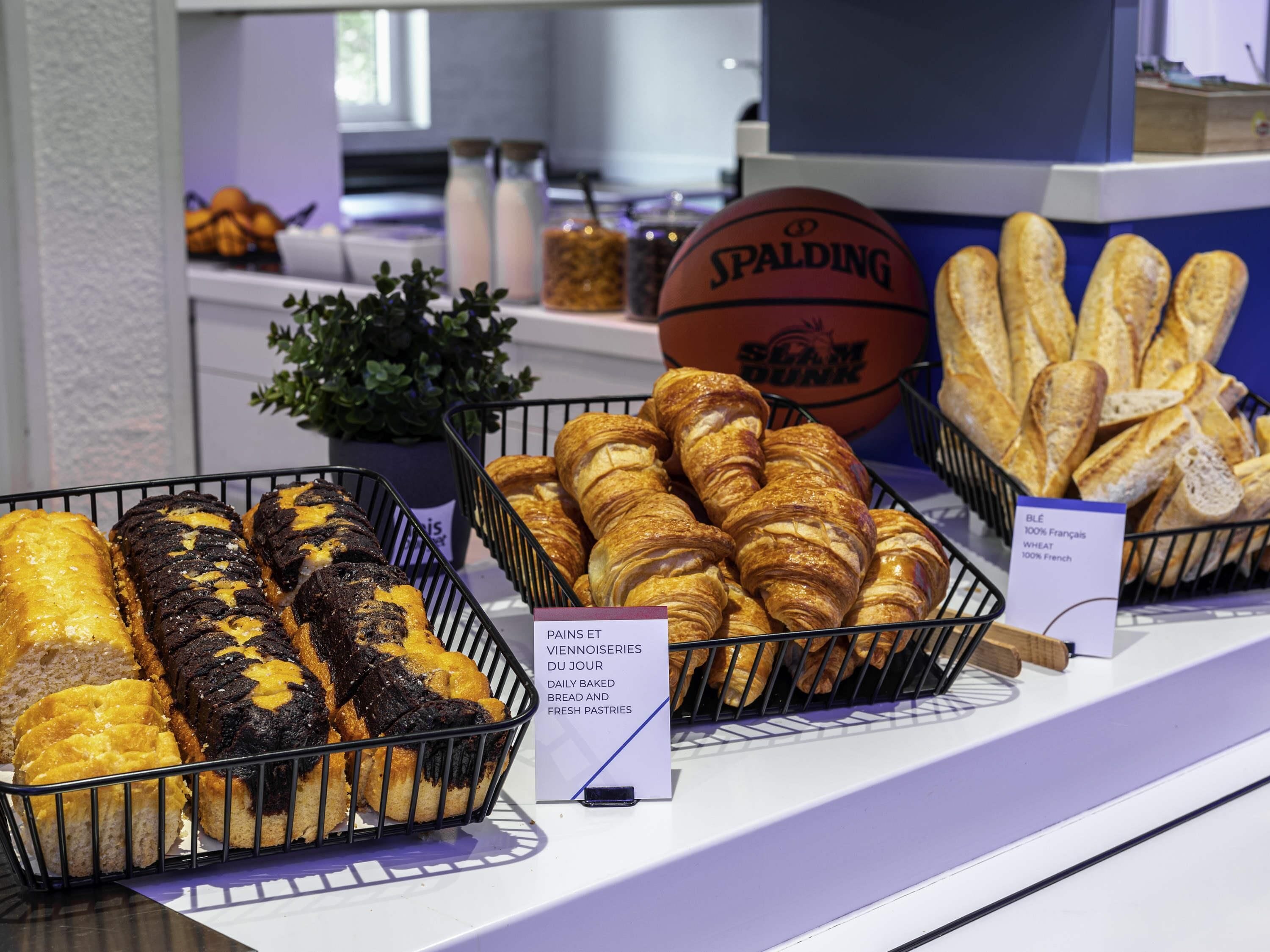 A bakery display with various baked goods, including bread and pastries.