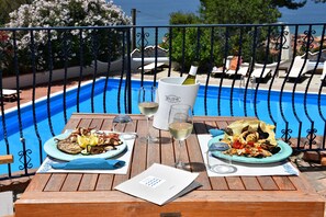 Lunch, dinner served; local cuisine, sea views
