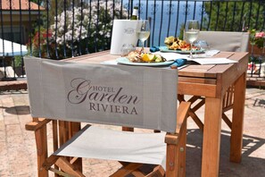 Lunch, dinner served; local cuisine, sea views