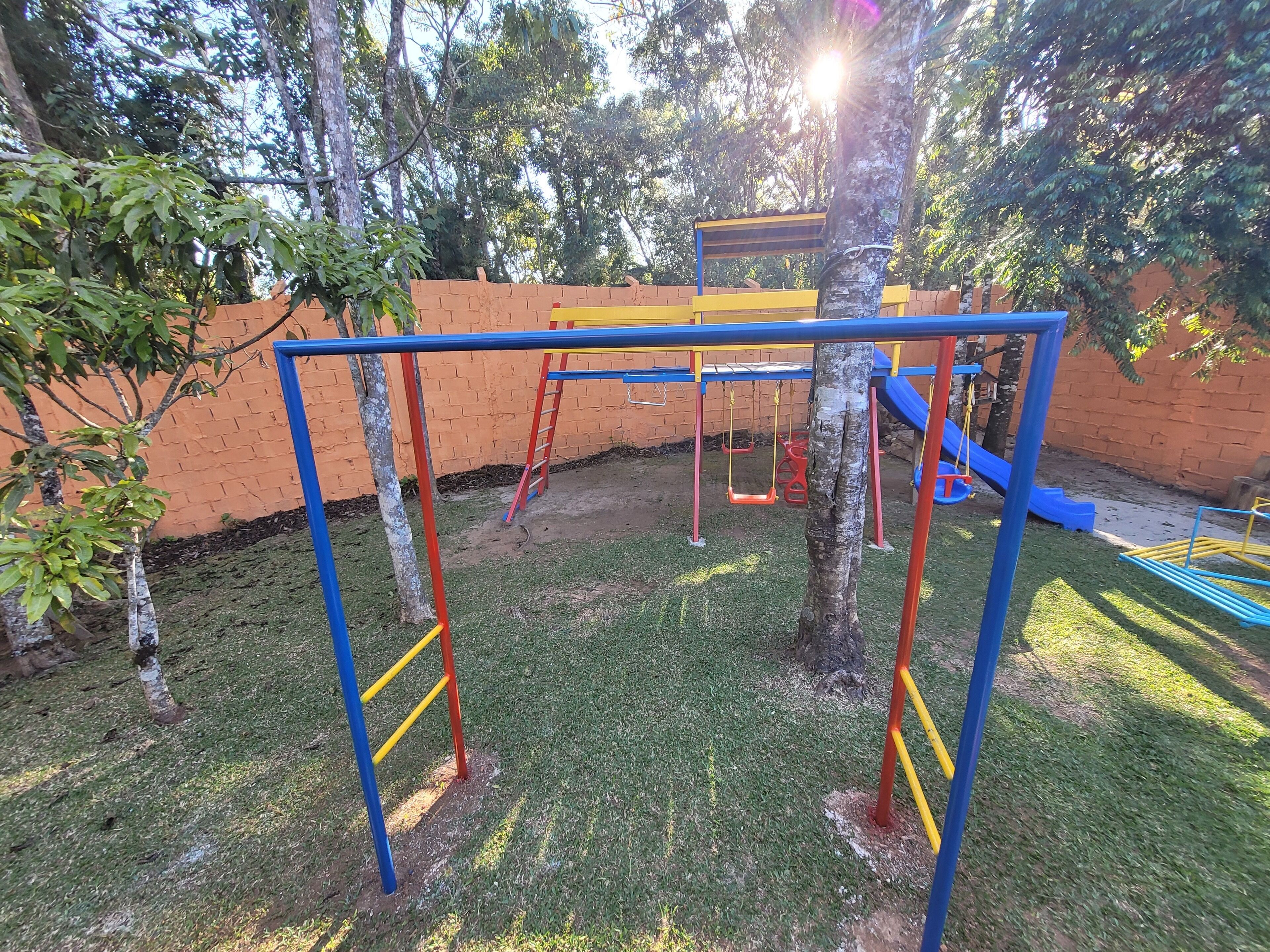 A playground with swings, slides, and climbing structures.