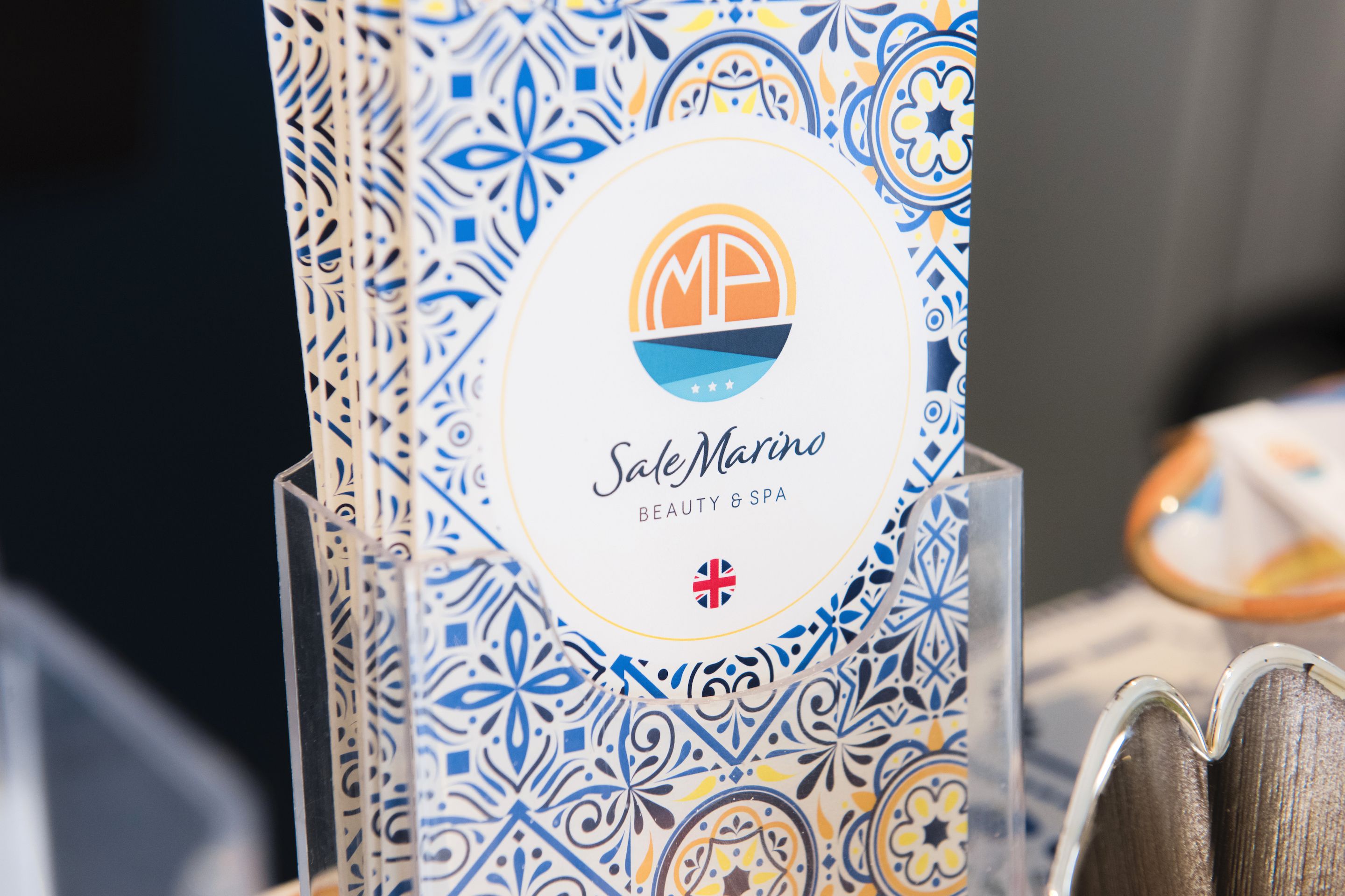 A brochure for Sale Marina Beauty & Spa with a decorative border.