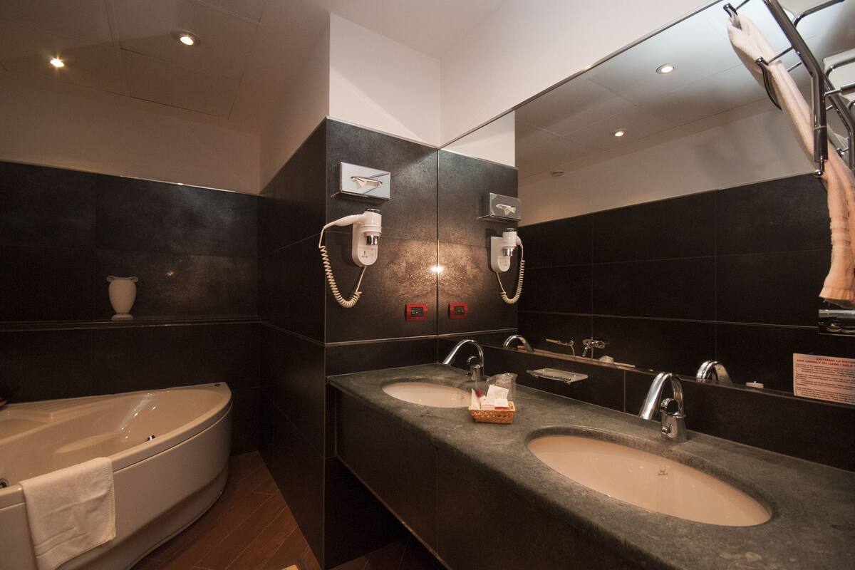 suite | bathroom | hair dryer, towels