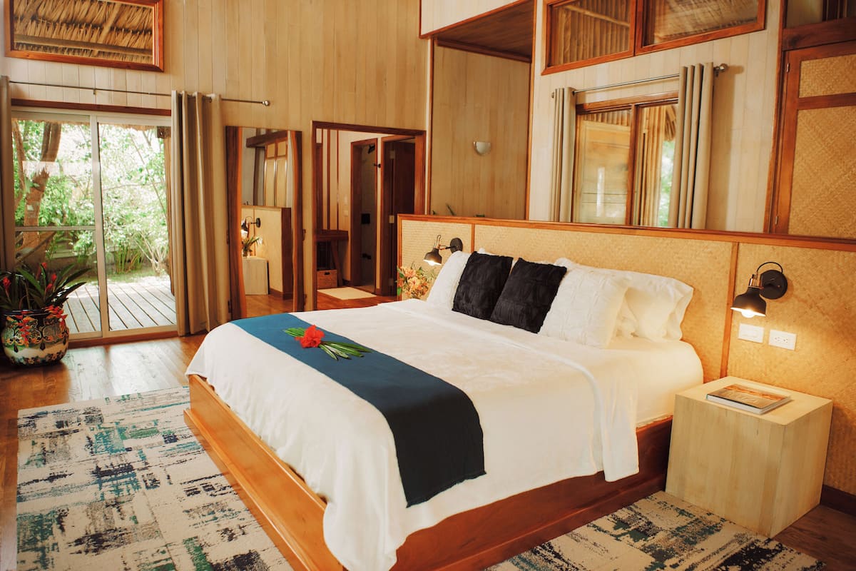 Modern Jungle Cabana w/ Air Conditioning | Premium bedding, minibar, in-room safe, desk