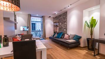 Quarto básico, 1 cama Queen, vista para o oceano | Área de estar