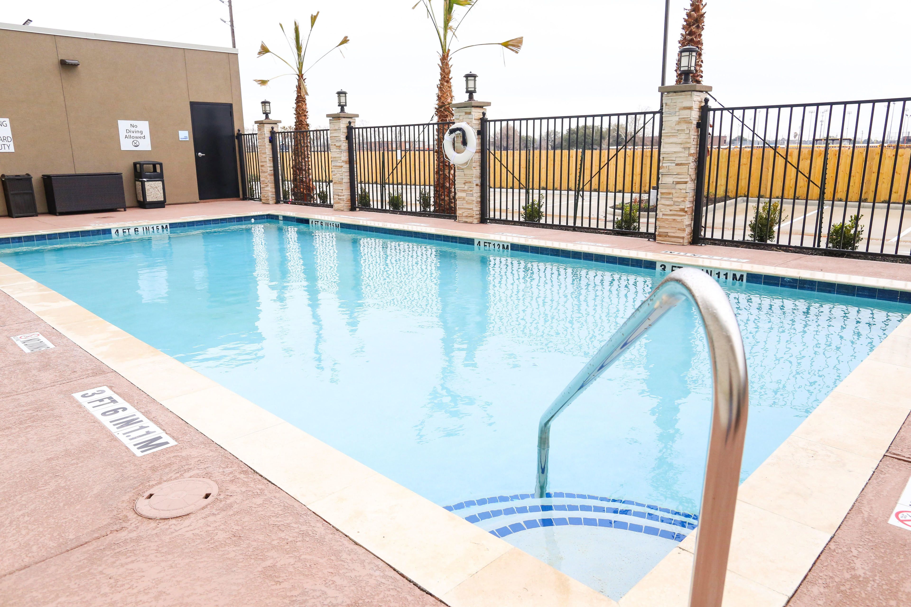 seasonal outdoor pool, open 10 am to 10 pm, pool loungers