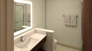 A modern bathroom with a large mirror, a sink, and a toilet. - Holiday Inn Express & Suites Houston IAH - Beltway 8 by IHG (Houston)