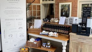 A bakery display with bread, pastries, and beverages. - The Talbot at Knightwick (Worcester)