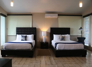 Panoramic Quadruple Room, 2 Queen Beds, Ocean View, Oceanfront | Living area | Flat-screen TV, DVD player - Vacation Rentals at Salitre (Arecibo)