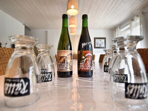 A table with various bottles, including a bottle with a label that reads "Rullets Blonde."