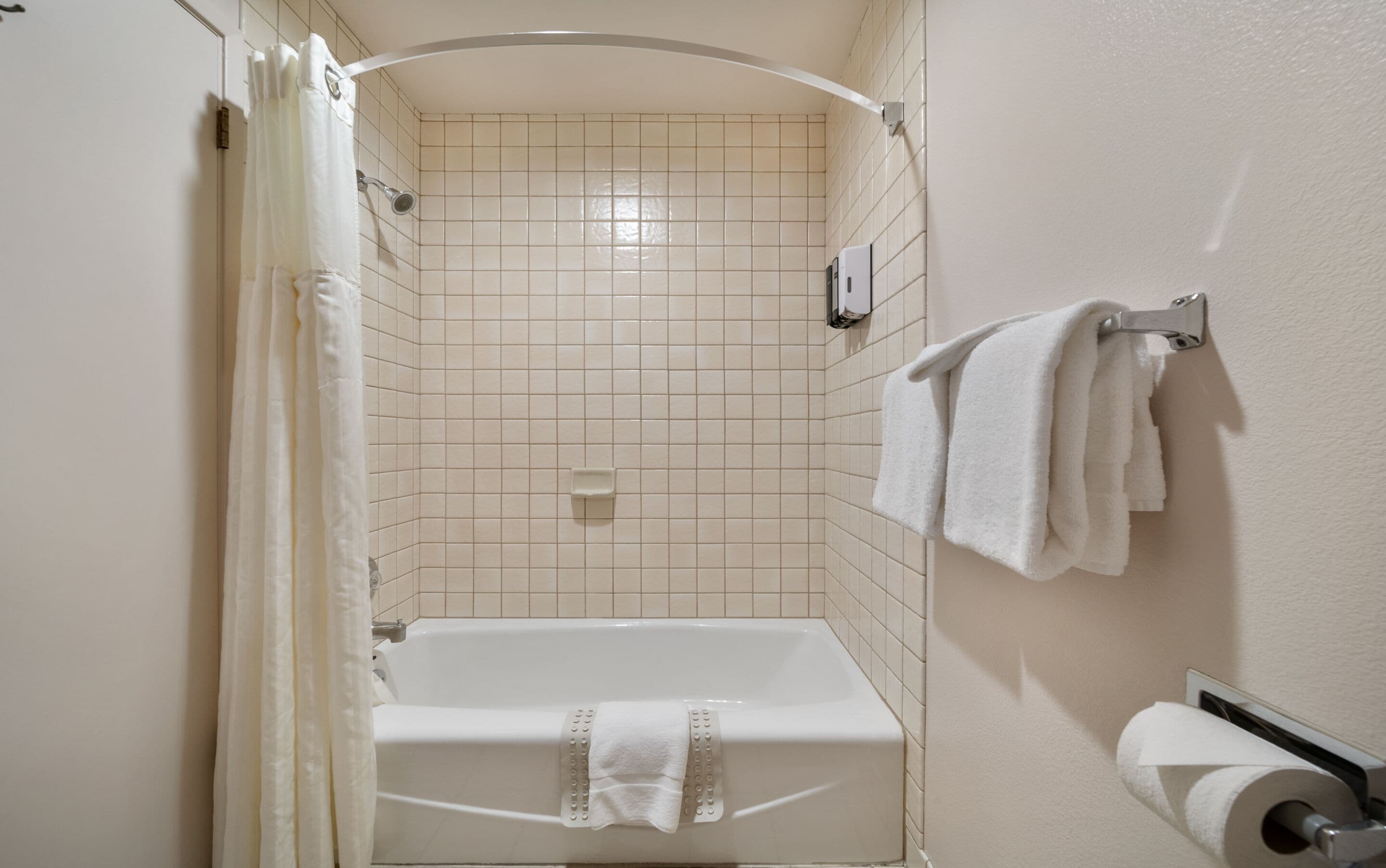 A bathroom with a bathtub, a shower, and a toilet.