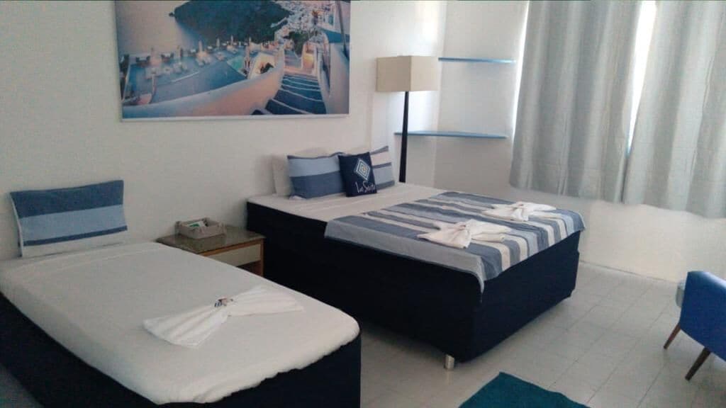 Triple Deluxe Suite | Hypo-allergenic bedding, minibar, laptop workspace, rollaway beds