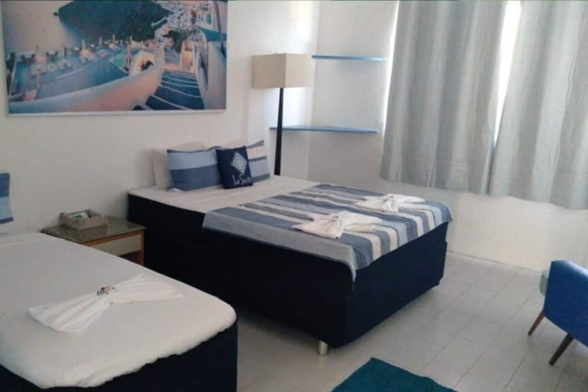 Triple Deluxe Suite | Hypo-allergenic bedding, minibar, laptop workspace, rollaway beds