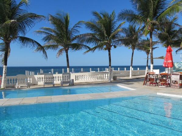 4 outdoor pools, open 9:00 AM to 9:30 PM, pool umbrellas, pool loungers