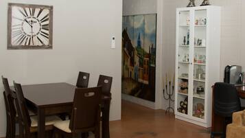 Basic Apartment, 3 Bedrooms (Apartment 9) | Living area | Flat-screen TV