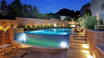 Outdoor pool, open 9:00 AM to 9:00 PM, free pool cabanas, pool loungers