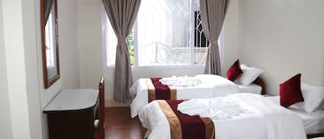 Economy Triple Room, 3 Bedrooms, Private Bathroom | In-room safe, desk, laptop workspace, WiFi (free)