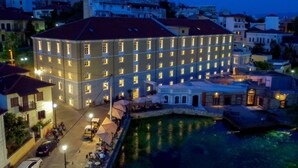 A multi-story hotel with a courtyard and a pool. - Hydrama Grand Hotel (Drama)