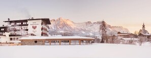 A hotel with a sign reading "HOTEL Gaihtof Penfion Tyrol" in a snowy landscape with mountains in the background. - Hotel Tyrol (Soell)