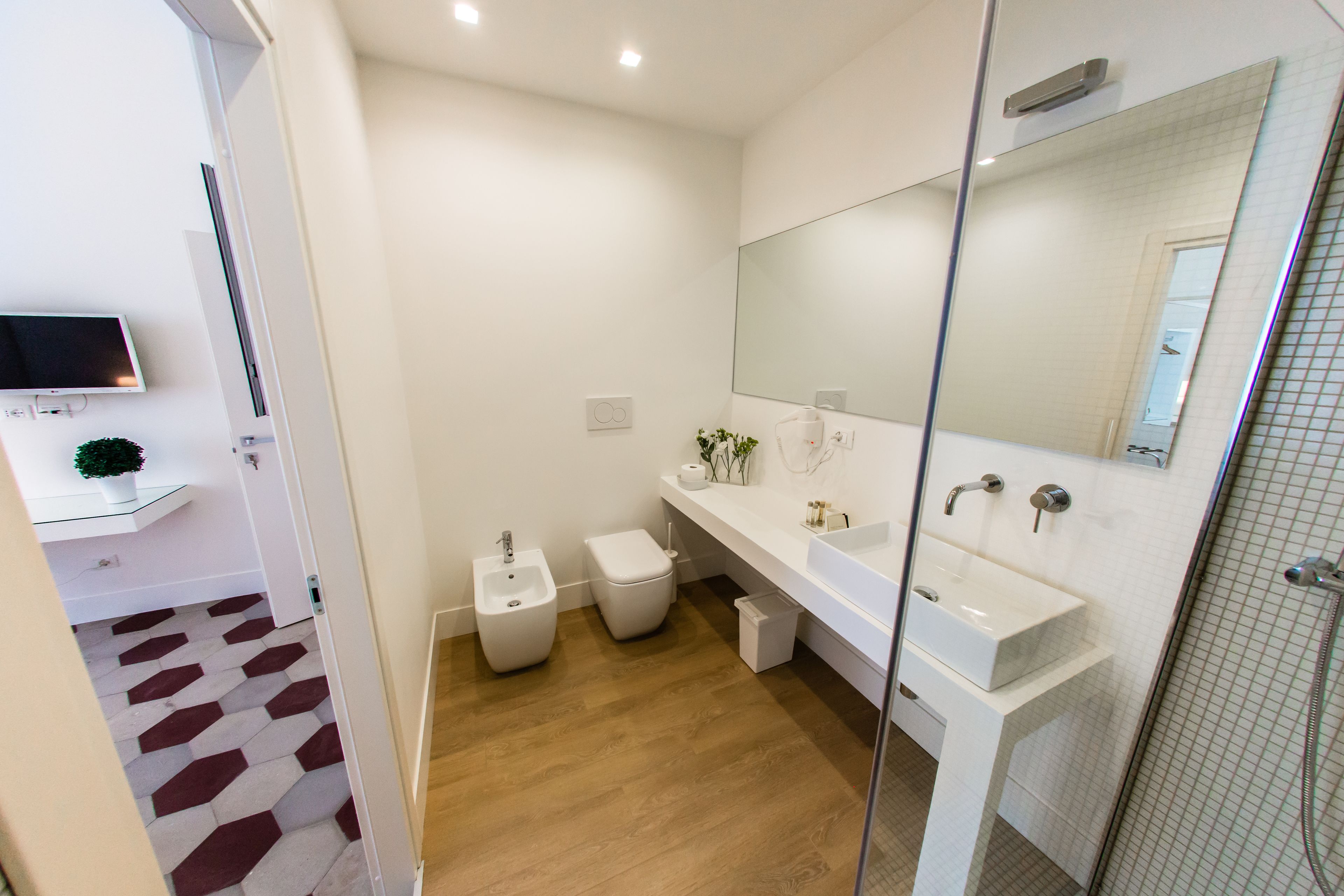 Deluxe Triple Room, 1 Bedroom, Private Bathroom | Bathroom | Shower, rainfall showerhead, hair dryer, bidet