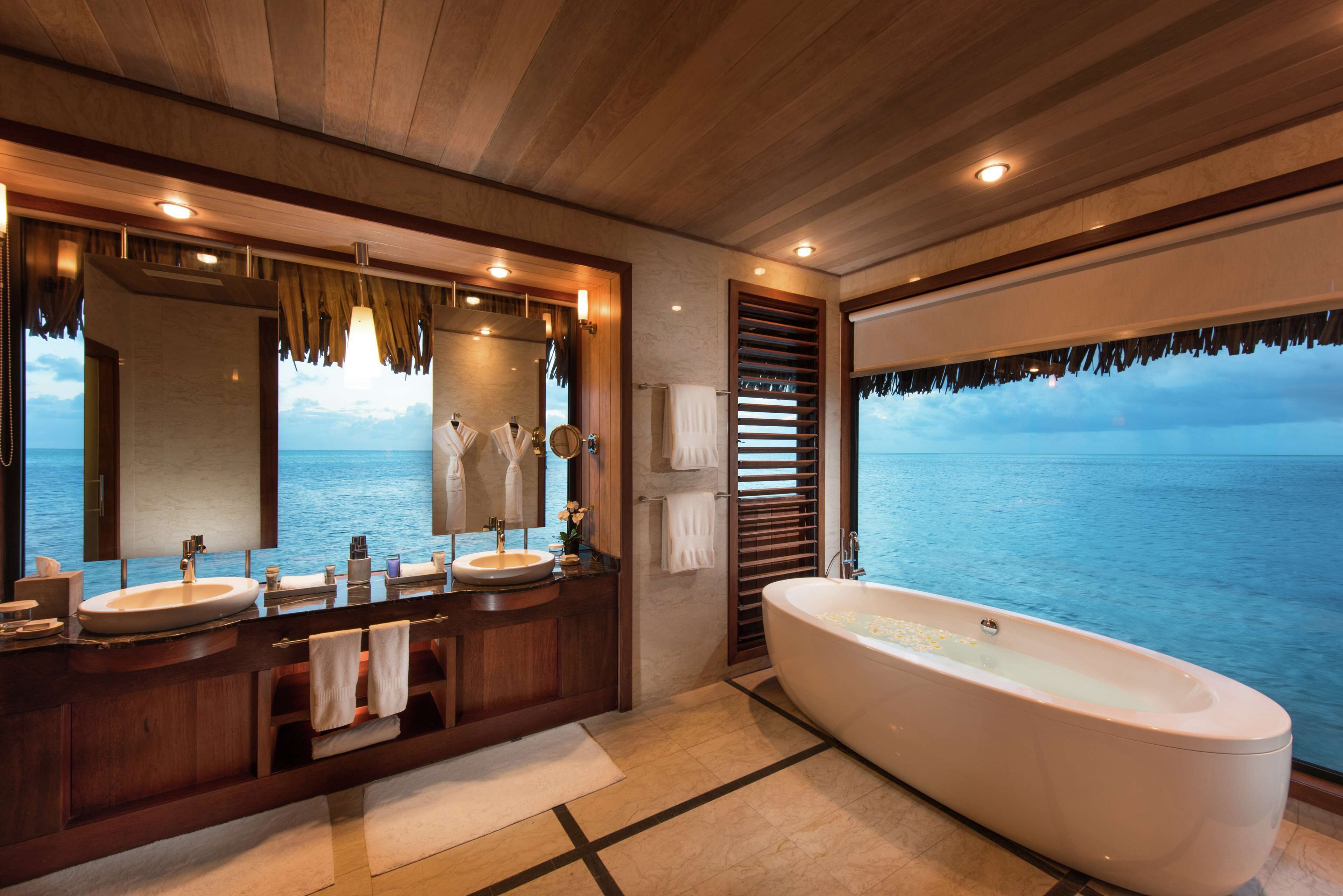 presidential overwater villa | bathroom | separate bathtub and shower, rainfall showerhead, free toiletries