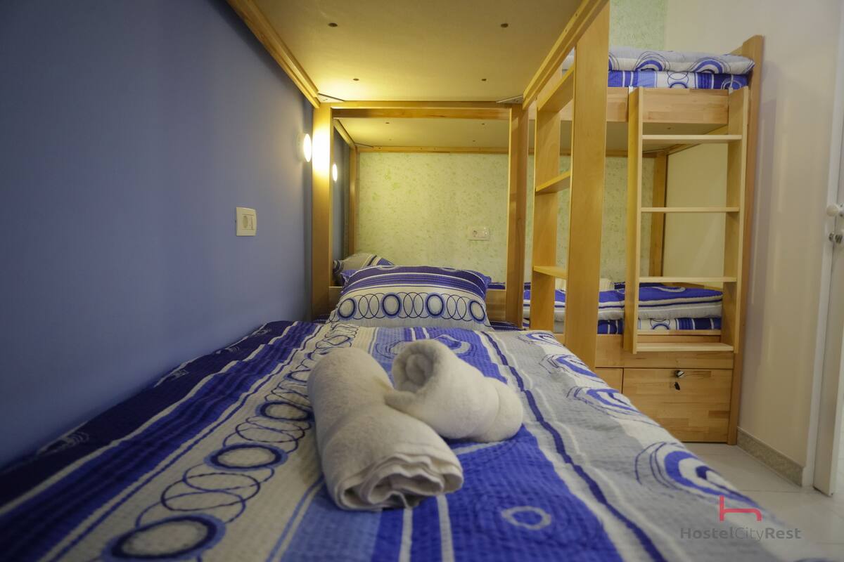 Economy Shared Dormitory, Bunk Bed, 3 rooms - 18 beds | Premium bedding, minibar, in-room safe, iron/ironing board