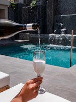 Seasonal outdoor pool, open 9:00 AM to 6:30 PM, pool umbrellas