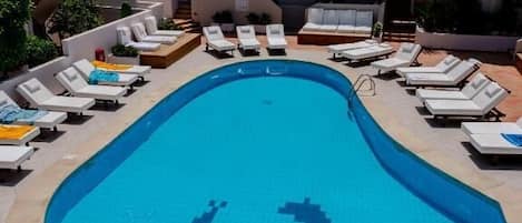 Seasonal outdoor pool, open 9:00 AM to 6:30 PM, pool umbrellas